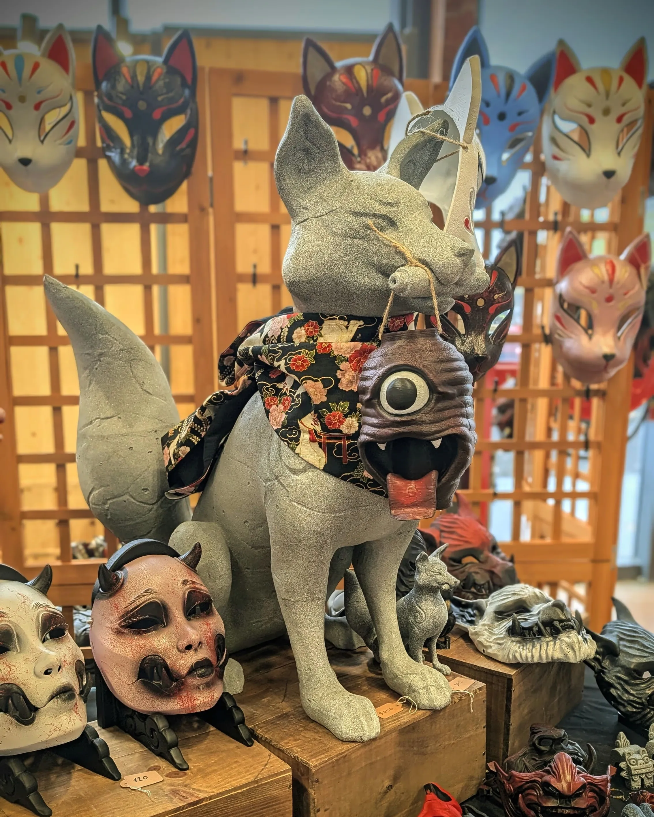 Kitsune figure and Japanese masks on stands